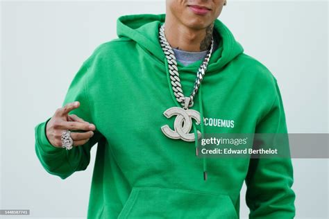 chanel chain central cee|Central Cee wears a Chanel large logo necklace, a green hoodie.